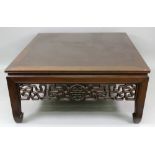 A large Chinese rosewood low centre table, 20th century, with pierced and carved friezes,