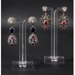 A pair of ruby and diamond-set silver gi
