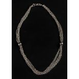 A white gold five row and bead necklace,