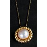 A mabé pearl, 18ct gold pendant, the cen