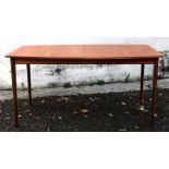 A retro McIntosh Furniture teak extending dining table, circa 1960's, with two fold-away leaves,