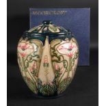 A Moorcroft jar and cover, tube lined wi