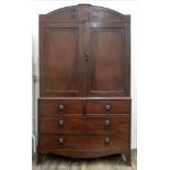 A Regency mahogany linen press, the arch