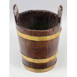 A brass bound oak bucket, 19th century,