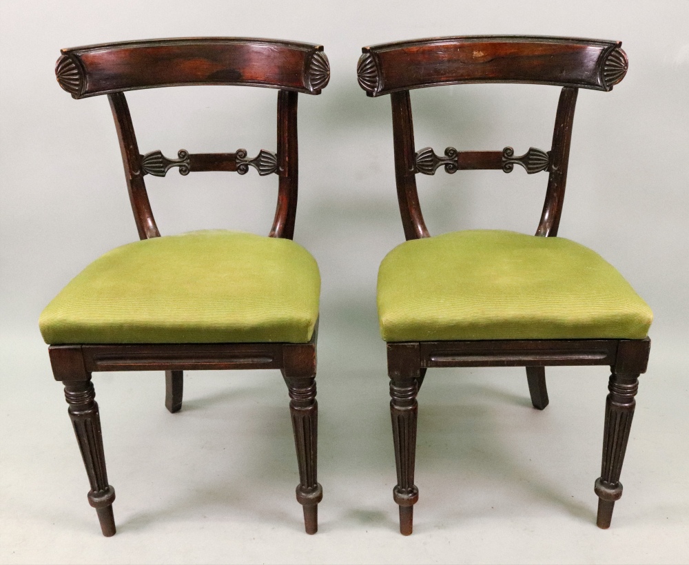 A pair of late Regency faux rosewood din