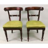 A pair of late Regency faux rosewood din