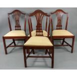 A set of four reproduction Hepplewhite style mahogany dining chairs,