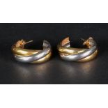 A pair of 18ct bi-gold half hoop earrings of twist design, 8.6g .