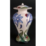 A Moorcroft vase and cover, tube lined w