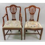 A set of eight Hepplewhite style mahogany dining chairs, with arched pierced vase splat backs,