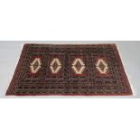 A Pakistan Bokhara rug, with four lozenge filled rectangular panels, 168 x 97cm.