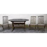 A slatted teak extending garden table, w