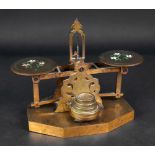 A set of Victorian engraved brass postal scales and weights, the pans enamelled with flowers,