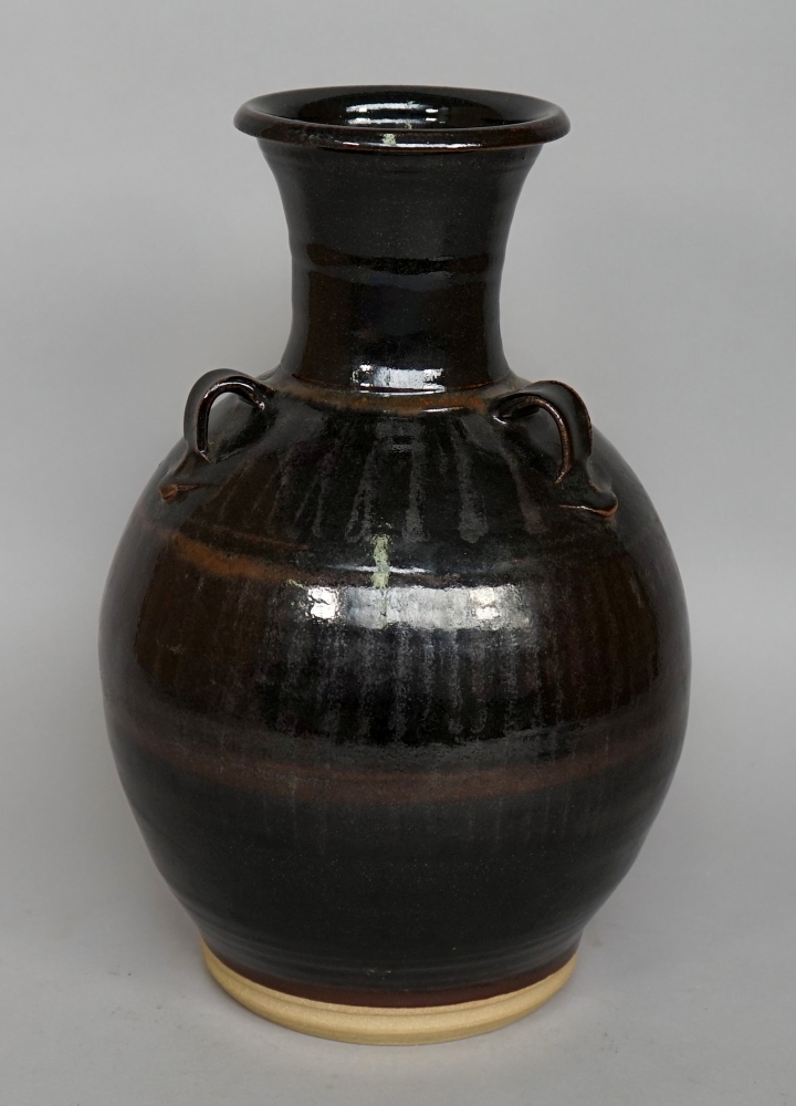 A large vase with three handles, decorat