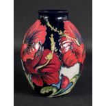 A Moorcroft vase, tube lined with flower