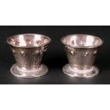 A pair of Arts & Crafts silver salt cellars, Bernard Cuzner, Birmingham 1905,