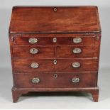 A George III mahogany bureau, alteration