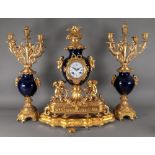 Tessier Rue St Honore 362 Paris; an ornate gilt metal mounted cobalt blue porcelain clock garniture,