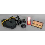 A Nikon FG camera with Sigma zoom lens,