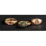 A Victorian yellow precious metal emerald and diamond set dress ring of cluster design,