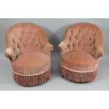 A pair of Dutch mahogany button down upholstered tub back armchairs, circa 1880, in pink dralon,