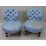 A pair of Victorian button down upholstered nursing chairs, with iron frames,