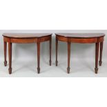 A pair of George III style mahogany demi lune console tables, 81cm wide x 33.5cm deep x 60cm high.