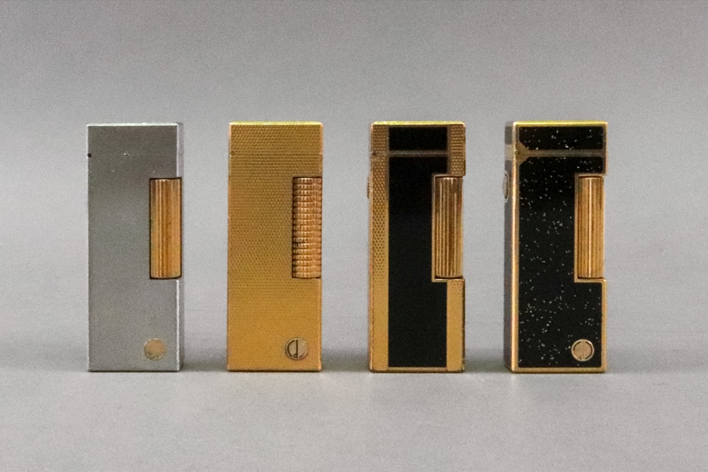 Four Alfred Dunhill lighters, one with brushed finish, one engine turned with repeated lozenges, - Image 2 of 2