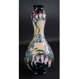 A Moorcroft vase, tube lined with flower