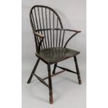 An ash and elm comb back Windsor elbow chair, first half 19th century.