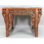 A Chinese altar table, 19th century, the rectangular top above carved and pierced friezes,