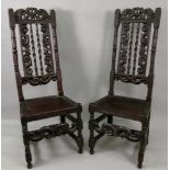 A pair of late 17th century oak side chairs, the high backs with crown,