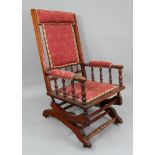 An Edwardian walnut frame rocking chair,