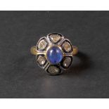 A silver gilt, cabochon kyanite and diamond-set dress ring of flowerhead design,