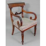 A William IV mahogany open arm elbow chair, with lotus leaf carving, stuff-over seat,