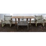 A slatted teak garden table, 180cm wide x 91cm deep x 71cm high,