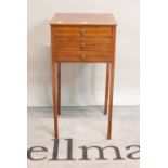 A 19th century mahogany and satinwood banded three drawer side table,