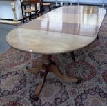 A Regency style mahogany boxwood strung and banded triple pillar dining table, 19th century,