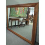 A large modern walnut framed rectangular mirror with bevelled plate, 195cm wide x 155cm high.