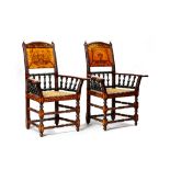 A pair of walnut rosewood sycamore ebonised floral marquetry open arm elbow chairs, Danish,