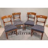 A set of four Victorian walnut bar back dining chairs on turned supports, 46cm wide x 85cm high.