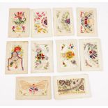 A collection of twelve French first world war period silk embroidered postcards.