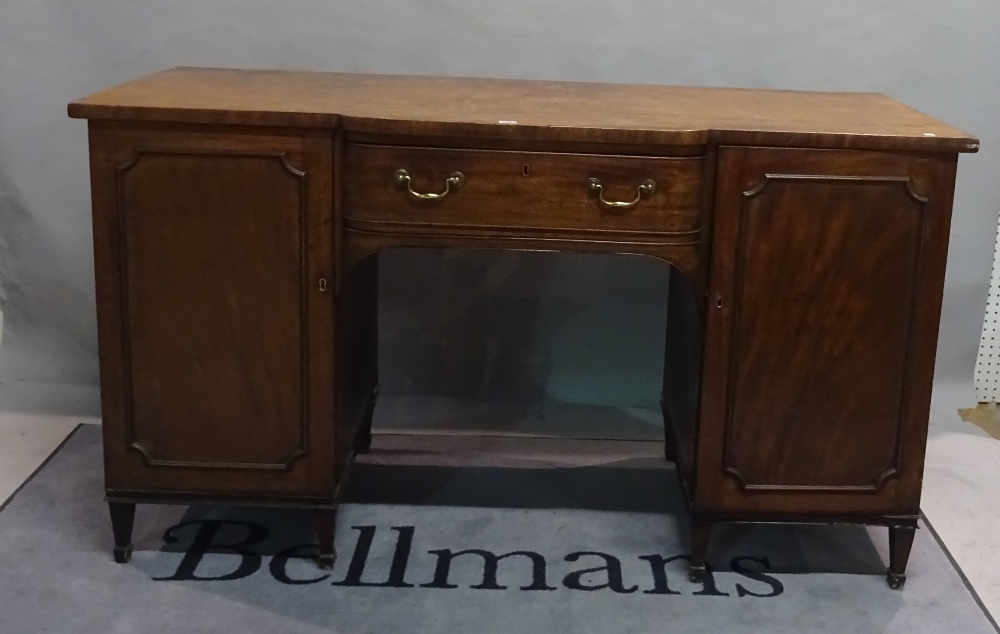 A late George III mahogany breakfront sideboard with single freize drawer flanked by moulded