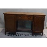 A late George III mahogany breakfront sideboard with single freize drawer flanked by moulded