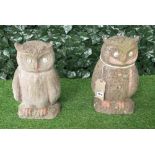 A pair of reconstituted stone figures of seated owls, 40cm high.
