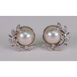 A pair of mabé pearl, 18ct white gold and diamond set earclips,