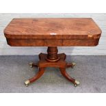 A Regency mahogany D-shaped card table on oval turned column and four downswept supports,