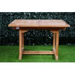 A hardwood square extending garden table, on block supports, 120cm wide x 180cm long extended.