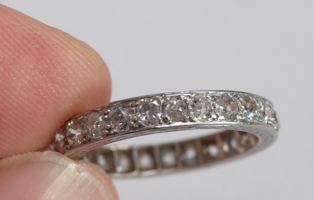 A platinum and diamond set full eternity ring, mounted with cushion shaped diamonds, - Image 4 of 6