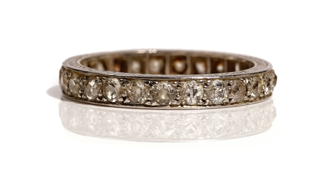 A platinum and diamond set full eternity ring, mounted with cushion shaped diamonds,